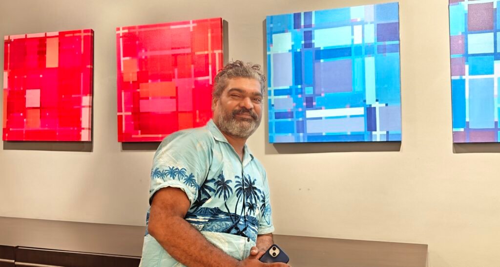 Rafique Shah with his works at his ongoing solo
